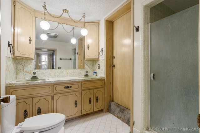 bathroom with backsplash, tile patterned floors, vanity, and an enclosed shower