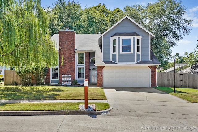 view of front of home featuring a front yard and a garage