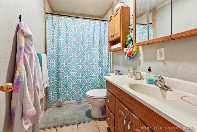 bathroom with tile patterned floors, vanity, toilet, and a shower with shower curtain