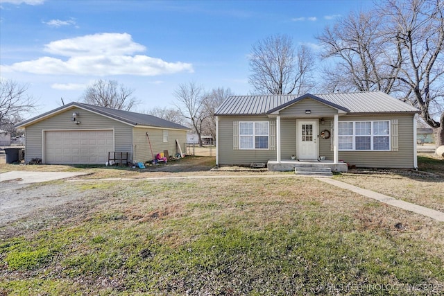 view of front of home with a garage and a front yard