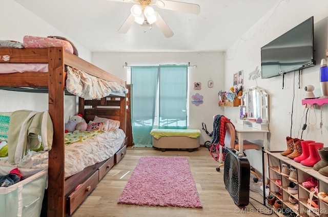 bedroom with ceiling fan and light hardwood / wood-style flooring