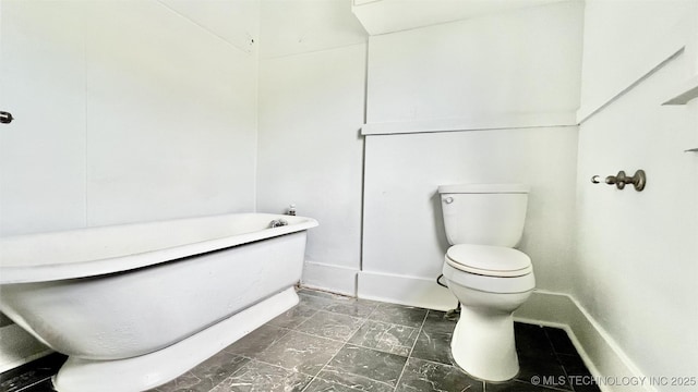 bathroom featuring a bathtub and toilet