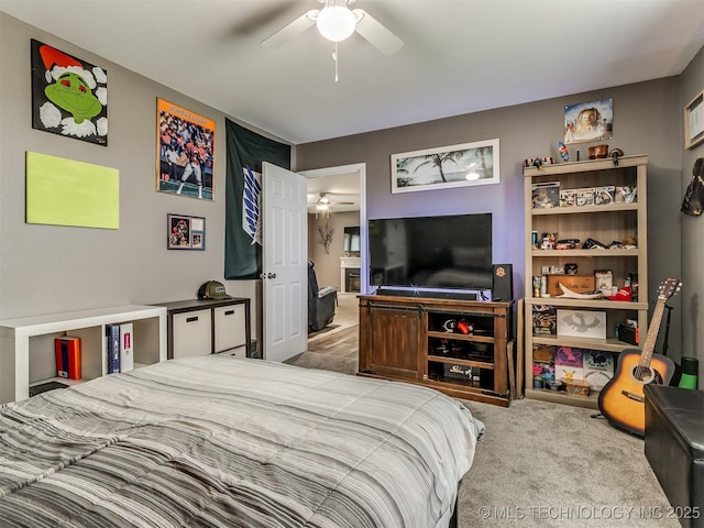 carpeted bedroom with ceiling fan