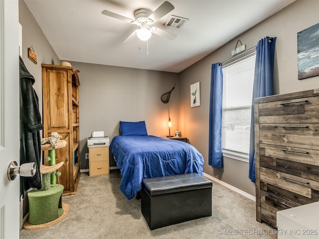 bedroom featuring ceiling fan and light carpet