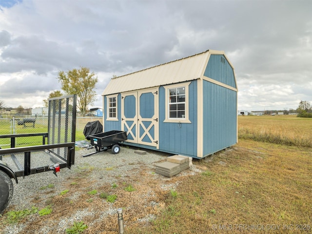 view of outbuilding with a lawn