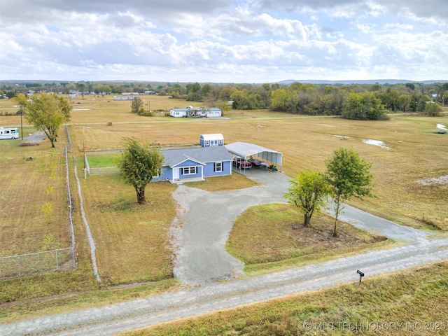 birds eye view of property with a rural view