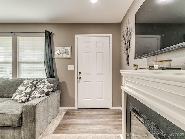 foyer entrance with light hardwood / wood-style floors