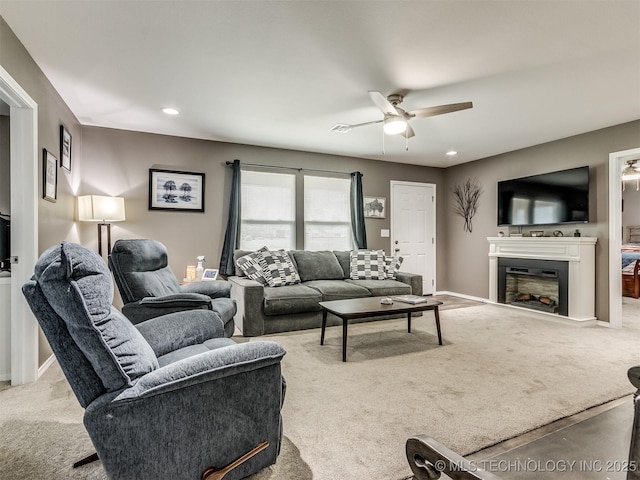 living room with ceiling fan and light colored carpet