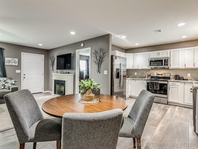 dining area featuring light hardwood / wood-style floors