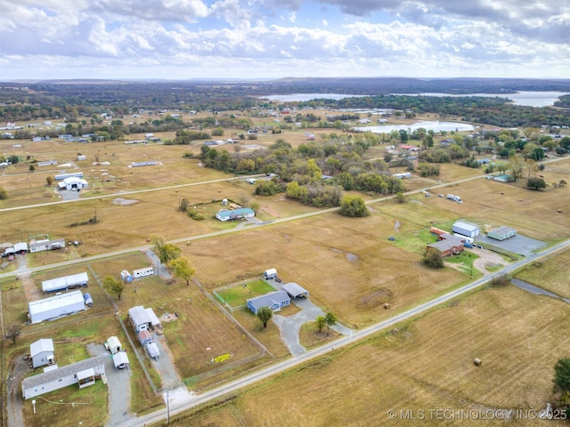 bird's eye view featuring a water view and a rural view