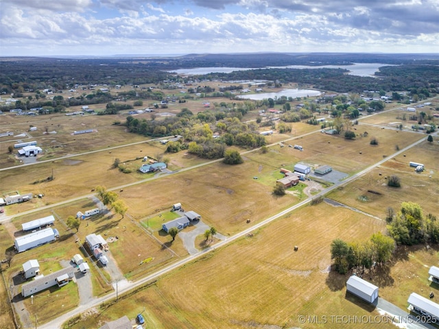 drone / aerial view featuring a water view and a rural view