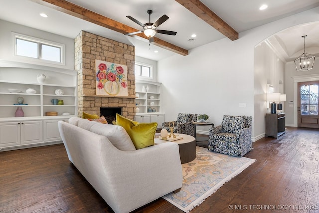 3913 S Dogwood Blvd, Broken Arrow, OK 74012 - living area featuring plenty of natural light, dark wood-style flooring, a fireplace, and beamed ceiling