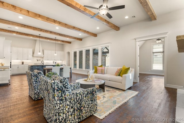 3913 S Dogwood Blvd, Broken Arrow, OK 74012 - living room with beamed ceiling, dark wood finished floors, visible vents, and baseboards