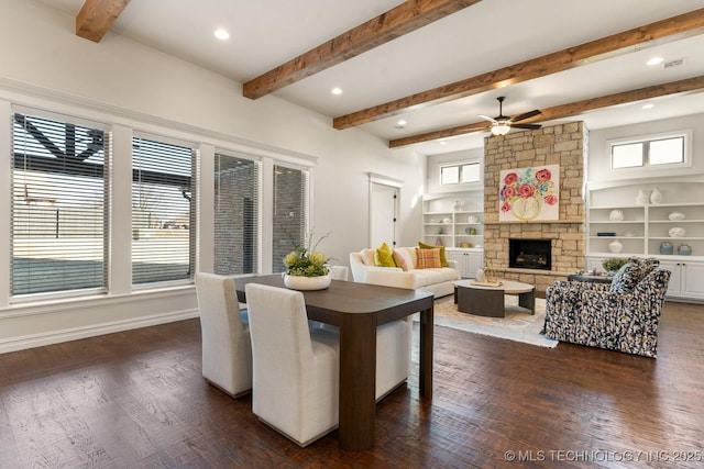 3913 S Dogwood Blvd, Broken Arrow, OK 74012 - dining room featuring plenty of natural light, baseboards, dark wood-type flooring, and a stone fireplace