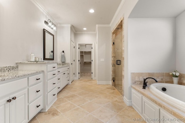 3913 S Dogwood Blvd, Broken Arrow, OK 74012 - full bath with vanity, ornamental molding, a bath, a stall shower, and a walk in closet
