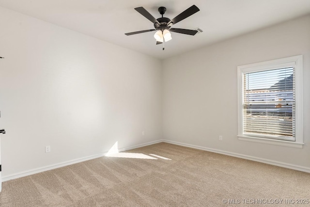 3913 S Dogwood Blvd, Broken Arrow, OK 74012 - spare room featuring a ceiling fan, light colored carpet, and baseboards