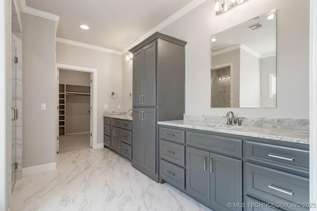 bathroom featuring vanity, an enclosed shower, and crown molding