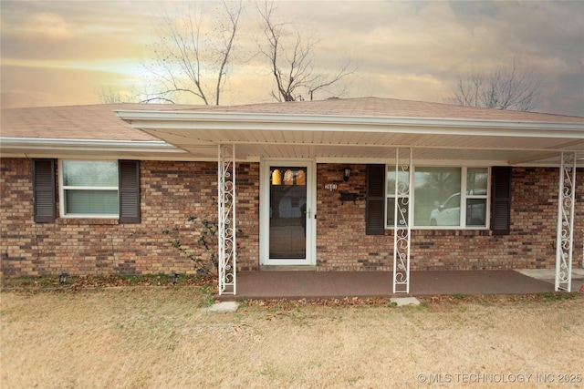 exterior entry at dusk with a porch