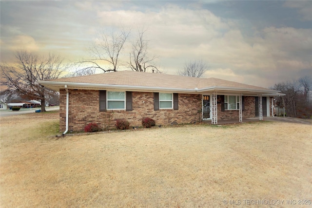 ranch-style home featuring a yard