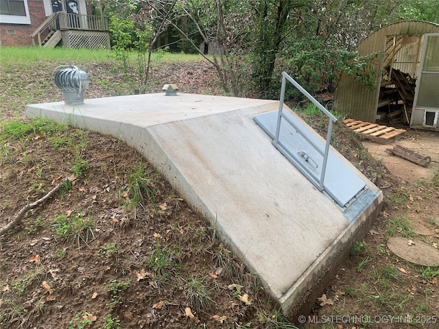 view of entry to storm shelter