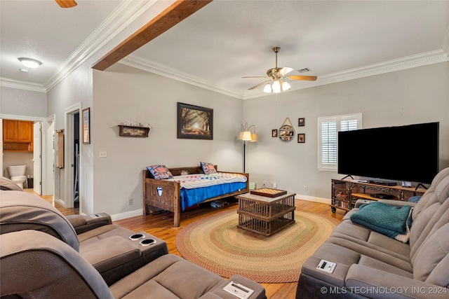 living room with light hardwood / wood-style flooring, ceiling fan, and crown molding