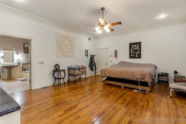 bedroom featuring hardwood / wood-style floors, ceiling fan, and ornamental molding