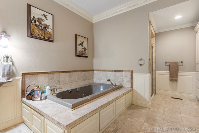 bathroom with a tub to relax in and crown molding