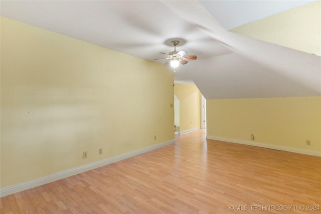 additional living space featuring ceiling fan, lofted ceiling, and light hardwood / wood-style flooring