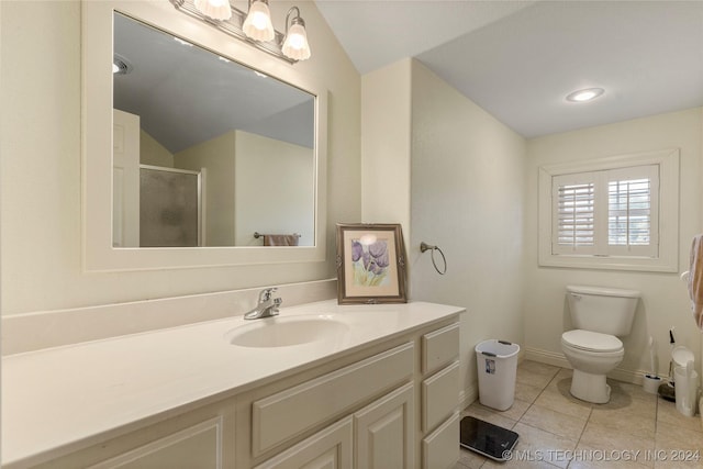 bathroom featuring tile patterned floors, an enclosed shower, vaulted ceiling, toilet, and vanity