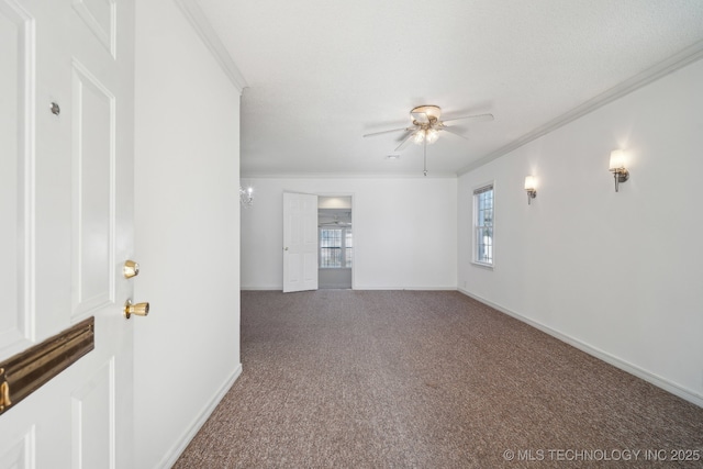 carpeted empty room featuring ceiling fan, a healthy amount of sunlight, and ornamental molding