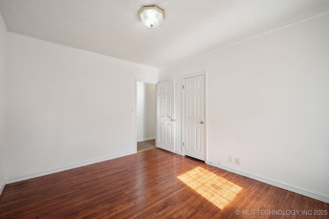 empty room with wood-type flooring