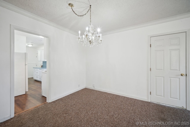 unfurnished room with dark carpet, a textured ceiling, an inviting chandelier, and ornamental molding