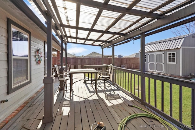 deck with a pergola, a yard, and a storage shed