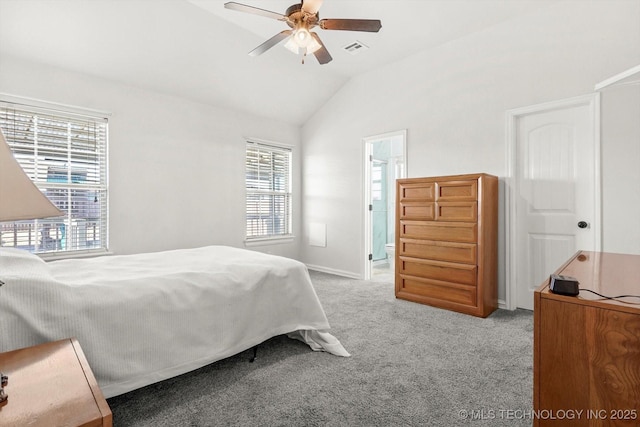 bedroom with connected bathroom, ceiling fan, light carpet, and vaulted ceiling