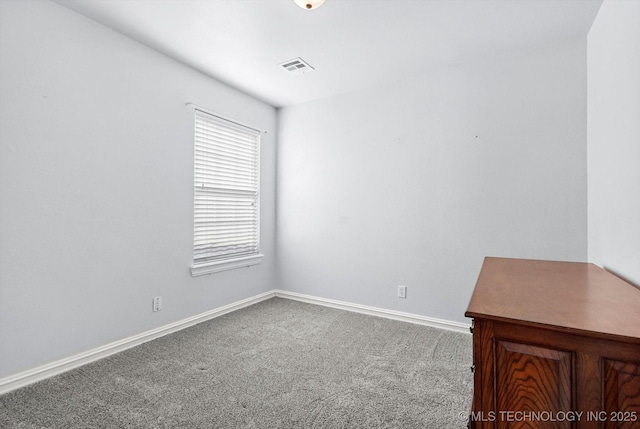 view of carpeted spare room