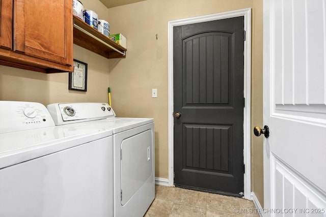 laundry area featuring cabinets and independent washer and dryer