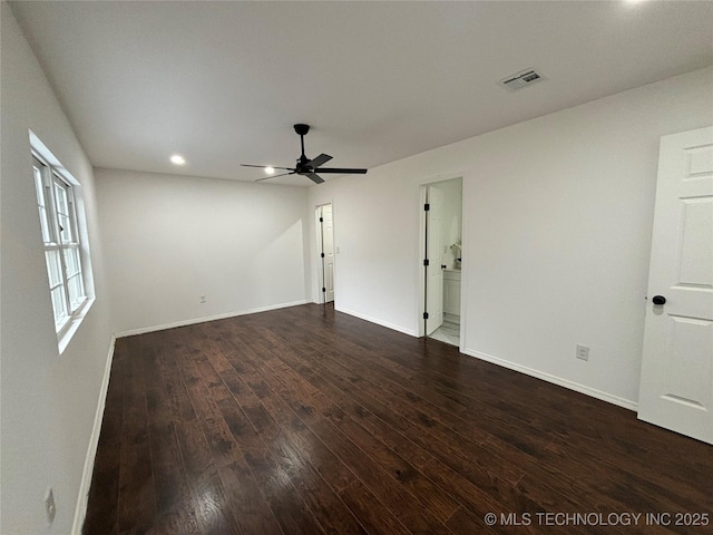 unfurnished room with ceiling fan and dark hardwood / wood-style flooring