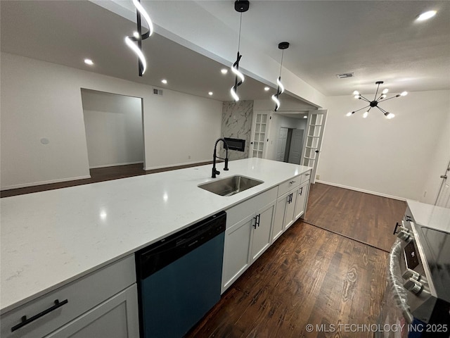 kitchen featuring stainless steel dishwasher, sink, an inviting chandelier, white cabinetry, and hanging light fixtures