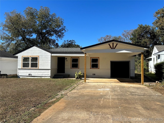 ranch-style home featuring a carport and a garage