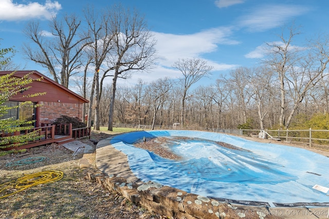 view of pool with a wooden deck