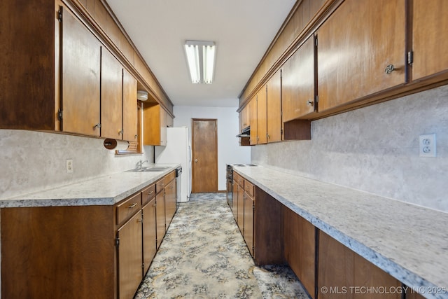 kitchen featuring decorative backsplash, sink, and white appliances