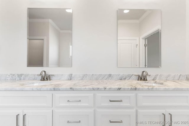 bathroom with vanity and ornamental molding