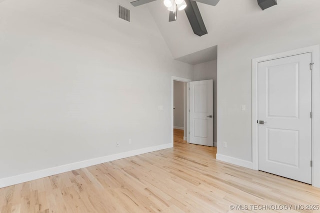 unfurnished bedroom with light wood-type flooring, high vaulted ceiling, and ceiling fan