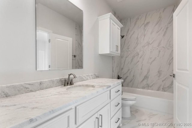 full bathroom featuring vanity, tiled shower / bath combo, and toilet