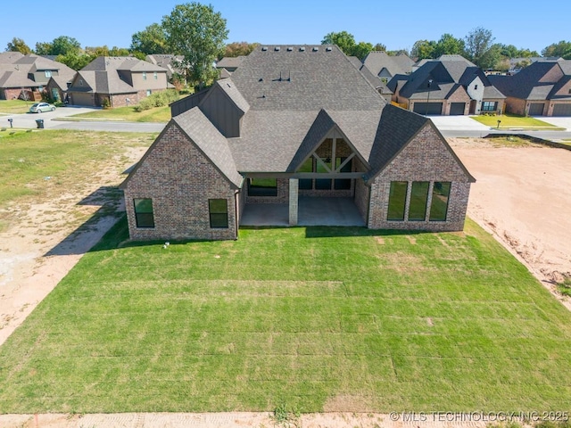 exterior space featuring a lawn and a patio