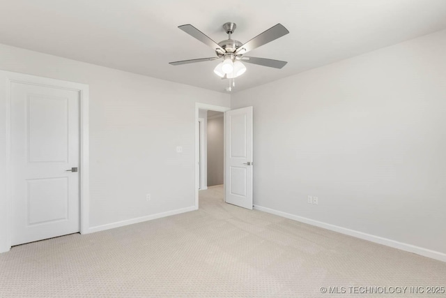 unfurnished bedroom with light carpet and ceiling fan