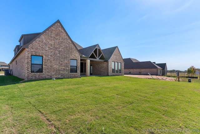 exterior space featuring a front lawn and a patio