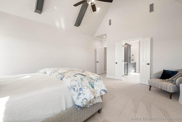 bedroom with ceiling fan, light carpet, and high vaulted ceiling