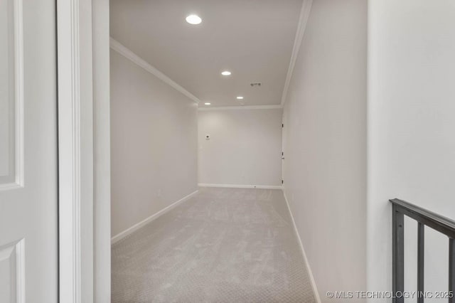 interior space featuring light carpet and ornamental molding