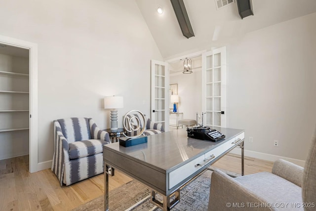 office space featuring hardwood / wood-style floors, high vaulted ceiling, french doors, beam ceiling, and a chandelier